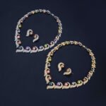 Wholesale Curve Pearl Set featuring CZ paved curl motifs cradling colorful shell pearls on gold plated copper from JuneJewelry.com.