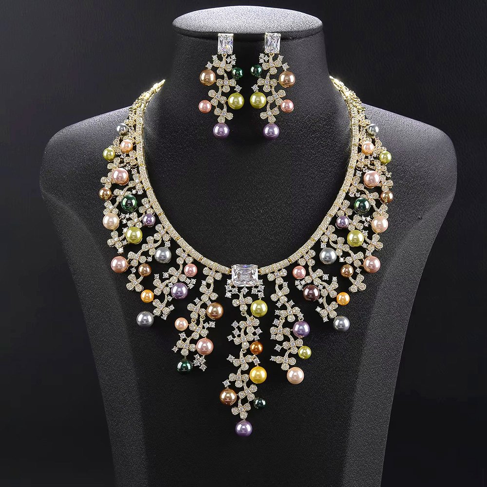 Wholesale Cascade Pearl Set featuring a CZ vine fringe collar with dangling colorful shell pearls on gold plated copper from JuneJewelry.com.