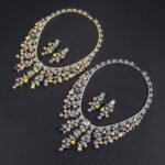Wholesale Cascade Pearl Set featuring a CZ vine fringe collar with dangling colorful shell pearls on gold plated copper from JuneJewelry.com.