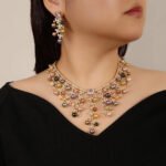 Wholesale Cascade Pearl Set featuring a CZ vine fringe collar with dangling colorful shell pearls on gold plated copper from JuneJewelry.com.