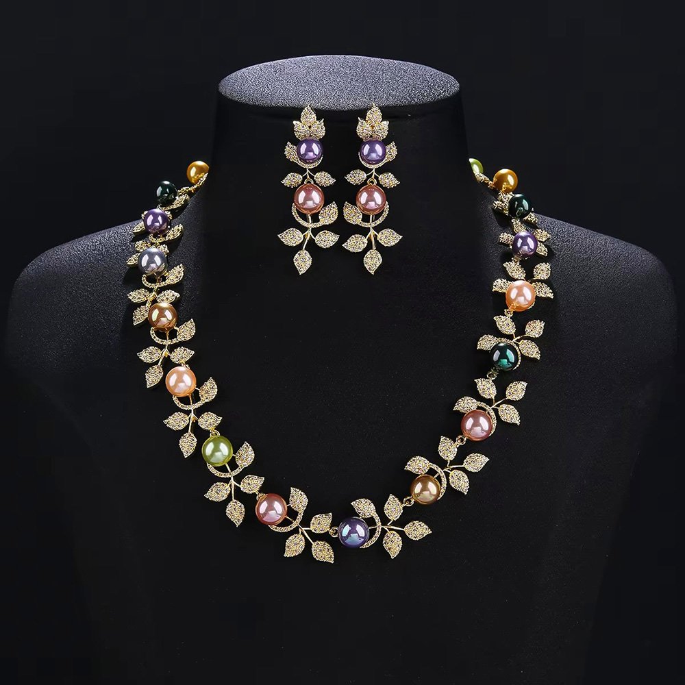 Wholesale Foliage Pearl Set featuring CZ micro paved leaf branches with colorful shell pearls on gold plated copper from JuneJewelry.com.