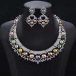Wholesale Shield Pearl Set featuring CZ micro paved arched plates with colorful shell pearls and marquise leaves on gold plated copper from JuneJewelry.com.