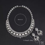 Wholesale Shield Pearl Set featuring CZ micro paved arched plates with colorful shell pearls and marquise leaves on gold plated copper from JuneJewelry.com.