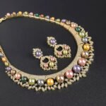 Wholesale Shield Pearl Set featuring CZ micro paved arched plates with colorful shell pearls and marquise leaves on gold plated copper from JuneJewelry.com.