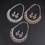 Wholesale Shield Pearl Set featuring CZ micro paved arched plates with colorful shell pearls and marquise leaves on gold plated copper from JuneJewelry.com.