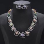 Wholesale Petal Pearl Set featuring CZ micro paved flower motifs with colorful shell pearls on gold plated copper from JuneJewelry.com.