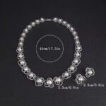 Wholesale Petal Pearl Set featuring CZ micro paved flower motifs with colorful shell pearls on gold plated copper from JuneJewelry.com.