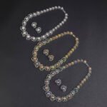 Wholesale Petal Pearl Set featuring CZ micro paved flower motifs with colorful shell pearls on gold plated copper from JuneJewelry.com.