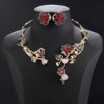 Wholesale Blossom Pearl Set featuring CZ paved cherry blossom branches with red zircons and shell pearls on gold plated copper from JuneJewelry.com.