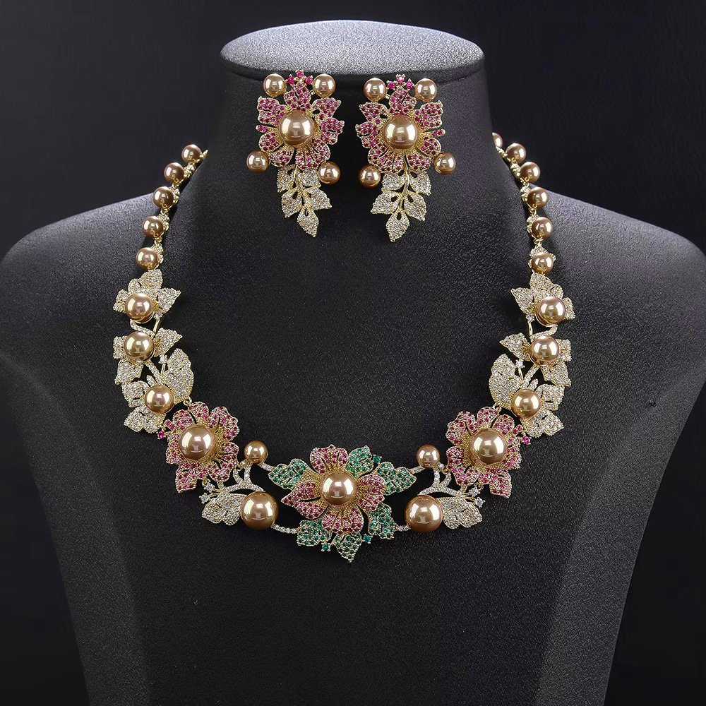 Wholesale Floral Pearl Set featuring pink green CZ flowers and champagne shell pearls on gold plated copper from JuneJewelry.com.