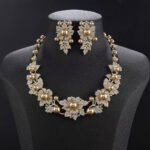 Wholesale Floral Pearl Set featuring pink green CZ flowers and champagne shell pearls on gold plated copper from JuneJewelry.com.