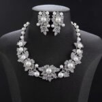 Wholesale Floral Pearl Set featuring pink green CZ flowers and champagne shell pearls on gold plated copper from JuneJewelry.com.