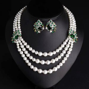 Wholesale Emerald Pearl Set featuring multi strand white shell pearls with green CZ leaf clasps on gold plated copper from JuneJewelry.com.