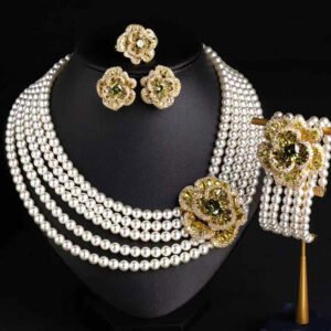 Wholesale Tiered Pearl Set featuring multi strand white shell pearls and CZ orange flower clasps on gold plated copper from JuneJewelry.com.