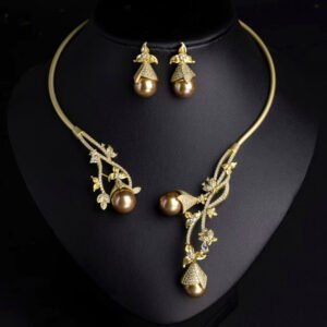 Wholesale Open Pearl Set featuring CZ micro paved branches with champagne shell pearls on gold plated copper from JuneJewelry.com.