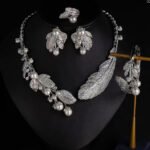 Wholesale Feather Pearl Set featuring colorful CZ paved feathers and champagne shell pearls on gold plated copper from JuneJewelry.com.