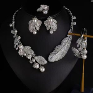 Wholesale Feather Pearl Set featuring colorful CZ paved feathers and champagne shell pearls on gold plated copper from JuneJewelry.com.