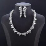 Wholesale Cluster Pearl Set featuring champagne shell pearls and CZ leaf motifs on gold plated copper from JuneJewelry.com.