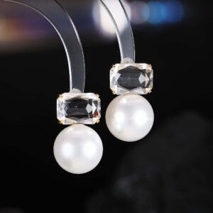 Emerald cut CZ freshwater pearl drop earrings featuring a radiant-cut cubic zirconia stud above a round freshwater pearl with 925 sterling silver ear posts
