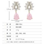 Tear drop crackle CZ teardrop earrings featuring a crystal halo teardrop stud with a suspended ice-crackle gemstone drop and 925 sterling silver ear posts.