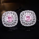 Luxury cushion cut CZ sunburst statement stud earrings featuring a central cushion-cut gemstone encircled by multi-tier pear-cut cubic zirconia halos with 925 sterling silver posts