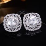 Luxury cushion cut CZ sunburst statement stud earrings featuring a central cushion-cut gemstone encircled by multi-tier pear-cut cubic zirconia halos with 925 sterling silver posts