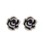 Layered enamel rose clip-on stud earrings featuring clear rhinestone-rimmed petals in rich red and classic black enamel finishes.