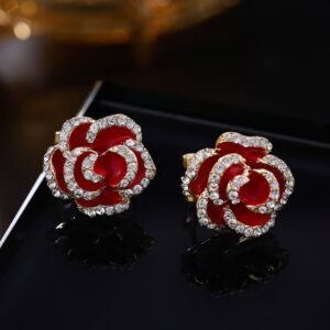 Layered enamel rose clip-on stud earrings featuring clear rhinestone-rimmed petals in rich red and classic black enamel finishes.