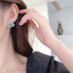 Tiger head CZ turquoise stud earrings featuring micro-pave cubic zirconia tiger motif with 925 sterling silver posts available on junejewelry.com