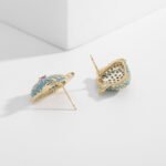 Tiger head CZ turquoise stud earrings featuring micro-pave cubic zirconia tiger motif with 925 sterling silver posts available on junejewelry.com