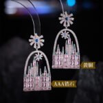 Whimsical fairytale castle arch drop earrings featuring firework star stud topper, pavé frame, and colorful CZ geometric crystal castle towers.