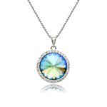 Swarovski element crystal round pendant necklace featuring a micro-paved cubic zirconia halo frame, brass base, premium palladium silver plating, and high-shine box chain.