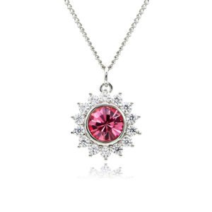 Swarovski crystal flower pendant wholesale featuring brilliant round crystal centerpiece, cubic zirconia starburst halo, palladium-plated brass base, and delicate silver chain.