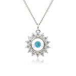 Swarovski crystal flower pendant wholesale featuring brilliant round crystal centerpiece, cubic zirconia starburst halo, palladium-plated brass base, and delicate silver chain.