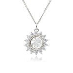 Swarovski crystal flower pendant wholesale featuring brilliant round crystal centerpiece, cubic zirconia starburst halo, palladium-plated brass base, and delicate silver chain.