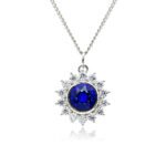 Swarovski crystal flower pendant wholesale featuring brilliant round crystal centerpiece, cubic zirconia starburst halo, palladium-plated brass base, and delicate silver chain.