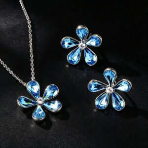 Wholesale flower jewelry set featuring platinum plated copper with sky blue Swarovski element crystal petals from JuneJewelry.com.