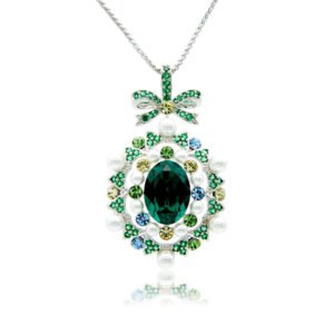 Swarovski crystal bow pendant wholesale featuring palladium plated brass chain, ornate ribbon bow, pearl cluster frame, and oval gemstone, SKU G100898E.