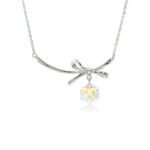 Swarovski crystal bow necklace wholesale with palladium plated brass chain, fluid metal ribbon pendant, and dangling geometric cube crystal, SKU G100907E.