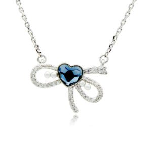 Swarovski crystal heart bow necklace wholesale made with palladium plated brass chain, pave cz bowknot, dainty pearl accents, and heart crystal, SKU G101034E.