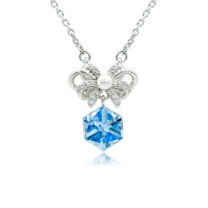 Swarovski crystal bow ribbon necklace wholesale featuring palladium plated brass chain, pave cz bowknot with center pearl, and dangling cube crystal, SKU G101037E.