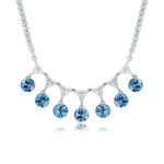 Swarovski crystal fringe necklace featuring 7 dangling round crystals hanging from a paved brass tennis chain base in palladium finish, SKU G101248E.
