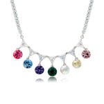 Swarovski crystal fringe necklace featuring 7 dangling round crystals hanging from a paved brass tennis chain base in palladium finish, SKU G101248E.