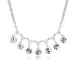 Swarovski crystal fringe necklace featuring 7 dangling round crystals hanging from a paved brass tennis chain base in palladium finish, SKU G101248E.