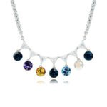 Swarovski crystal fringe necklace featuring 7 dangling round crystals hanging from a paved brass tennis chain base in palladium finish, SKU G101248E.