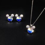 Wholesale Mickey jewelry set featuring platinum plated copper with iridescent Swarovski element crystals and pave ears from JuneJewelry.com.