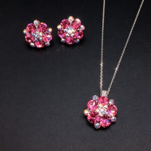 Wholesale floral crystal jewelry set featuring platinum plated copper with fuchsia pink Swarovski element crystals from JuneJewelry.com.