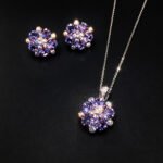 Wholesale floral crystal jewelry set featuring platinum plated copper with fuchsia pink Swarovski element crystals from JuneJewelry.com.