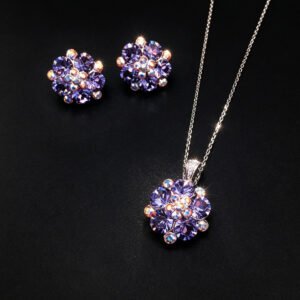 Wholesale floral crystal jewelry set featuring platinum plated copper with fuchsia pink Swarovski element crystals from JuneJewelry.com.