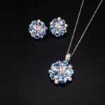 Wholesale floral crystal jewelry set featuring platinum plated copper with fuchsia pink Swarovski element crystals from JuneJewelry.com.